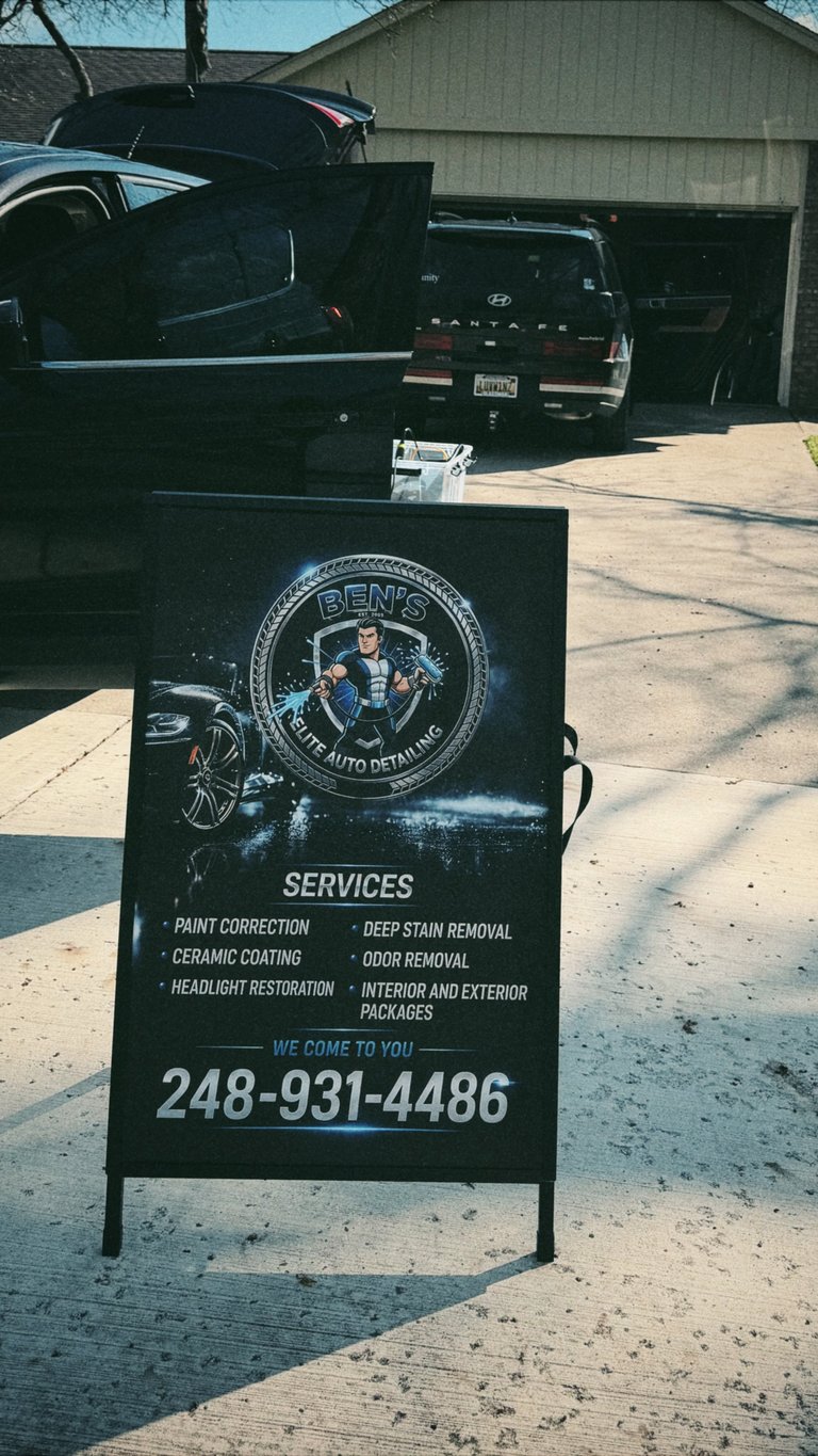 A-Frame sign for Bens Elite Auto Detailing advertising services like paint correction and ceramic coating, with phone number 248-931-4486 displayed